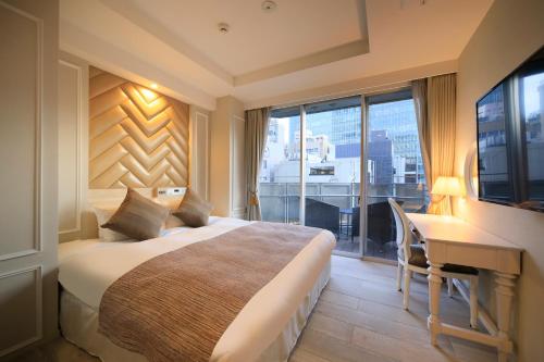 Ένα ή περισσότερα κρεβάτια σε δωμάτιο στο Centurion Hotel Residential Akasaka Station