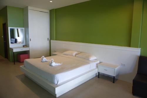 Кровать или кровати в номере Kohchang Privilege