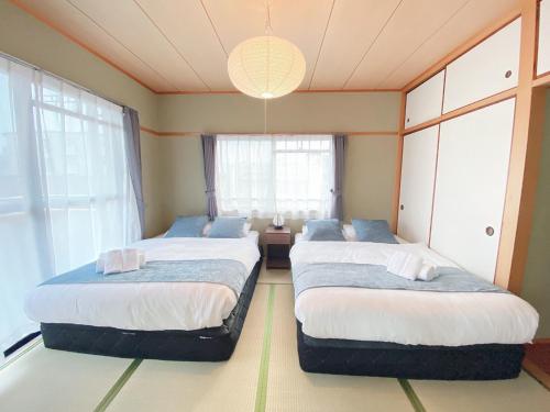 おうちホテル五日市にあるベッド