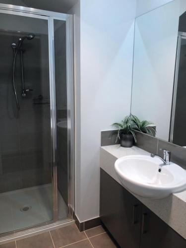 a bathroom with a sink and a shower at Bundalong Villas in Bundalong