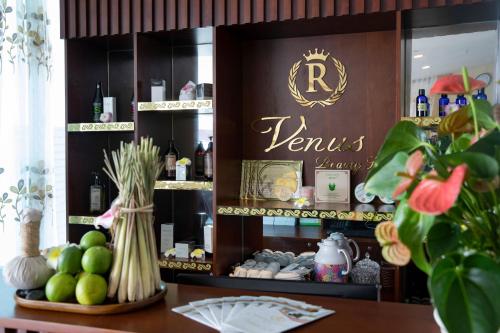 a store with a sign that says venus pharmacy at Regalia Gold Hotel in Nha Trang