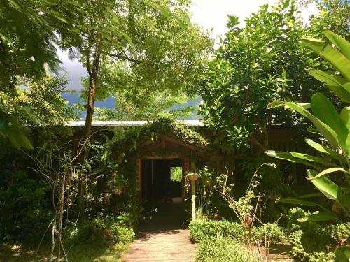 a small house in the middle of a forest at Flower and Green Collection in Shunan