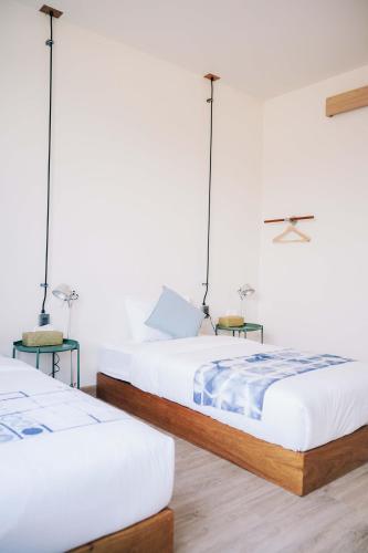 Ένα ή περισσότερα κρεβάτια σε δωμάτιο στο Small Town Hostel