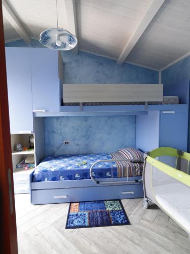 Tempat tidur dalam kamar di Glamour House Villasimius