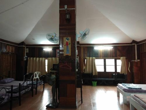 a living room with aamed ceilings and a room with at ทับศิลารีสอร์ท Tubsila Resort in Chongsadao