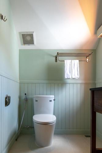 a bathroom with a white toilet in a room at La Em Boutique Villa in Da Lat
