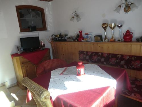 a dining room with a table with a candle on it at Apartment Leber in Ehrwald