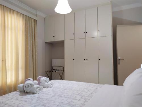 A bed or beds in a room at Nafplio City Apartments