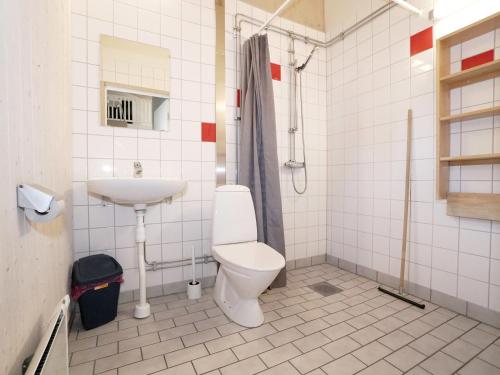 a bathroom with a toilet and a sink at Stuga i Järvsöbacken in Järvsö