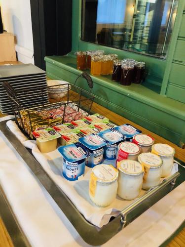 a tray filled with different types of food on a table at Sure Hotel by Best Western Argentan in Argentan