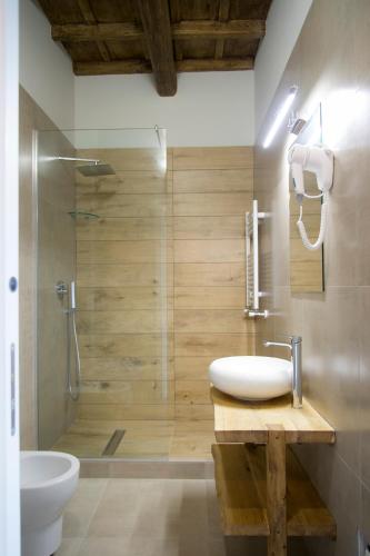 a bathroom with a sink and a shower at Le Boutique Luxury Rooms diffused in historical center in Fiumicino