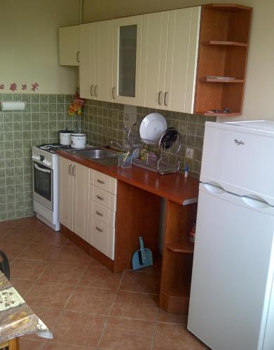 
A kitchen or kitchenette at Apartament Okęcie
