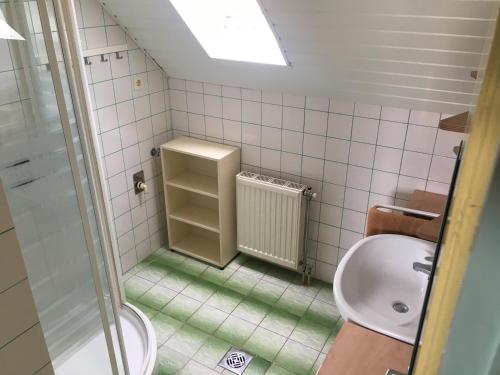 a bathroom with a toilet and a sink at Fanni Guest House in Balatonvilágos