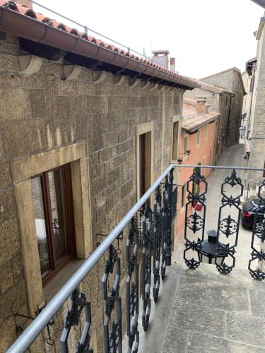 a balcony of a building with lights on it at Borgoloto Suite 17 in San Marino