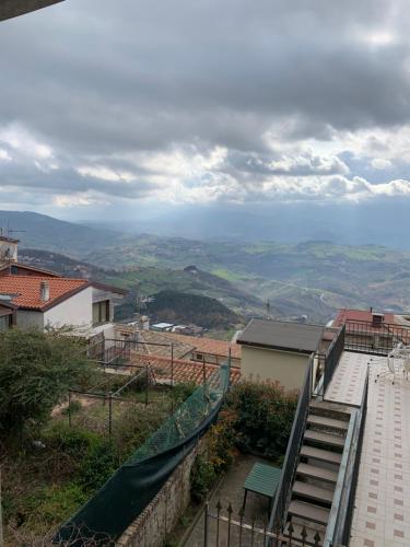a set of stairs leading up to a hill with a view at Borgoloto Suite 17 in San Marino