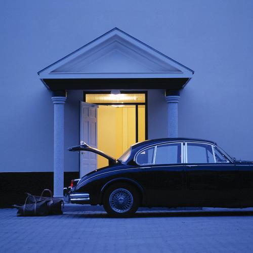 a car parked in front of a house at Gilleleje Badehotel in Gilleleje