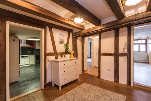 a kitchen with a white dresser and sliding glass doors at Ferienwohnung Rottweil Zentrum in Rottweil