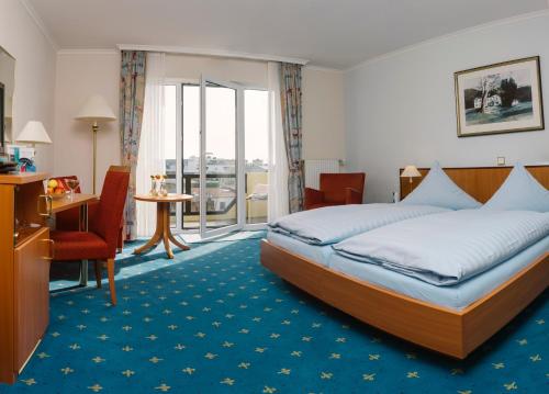 Postel nebo postele na pokoji v ubytování Aparthotel Kachelot
