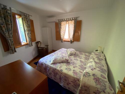 מיטה או מיטות בחדר ב-Casa Leite