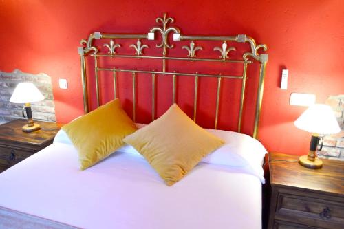 Ein Bett oder Betten in einem Zimmer der Unterkunft Hotel Alda Vía León