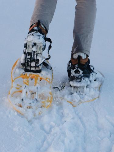 a person wearing snow shoes in the snow at Hotel Villa delle Fate, BW Signature Collection in Sestola