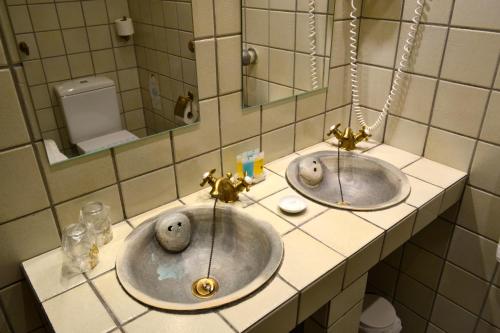 Ein Badezimmer in der Unterkunft Hotel Alda Vía León