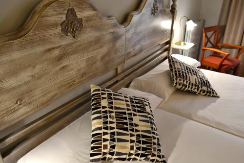 Ein Bett oder Betten in einem Zimmer der Unterkunft Hotel Alda Vía León