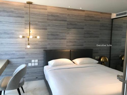 En eller flere senge i et værelse på ashley hotel bkk