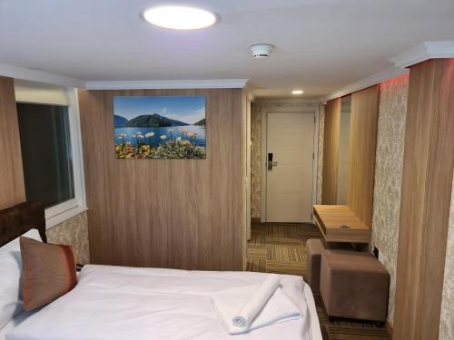 a hotel room with a bed and a desk at Helvetia in Seewen