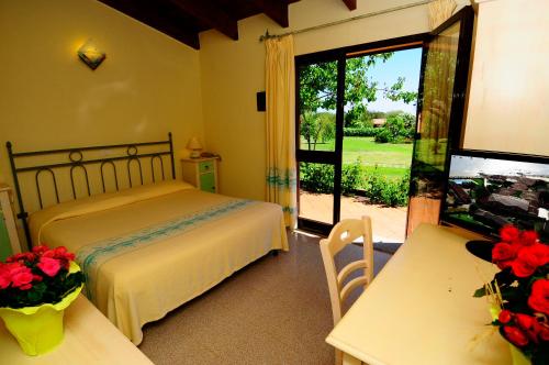 Ένα ή περισσότερα κρεβάτια σε δωμάτιο στο Hotel L'Esagono