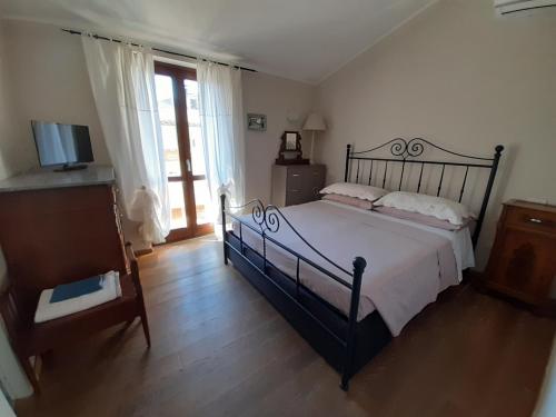 Postel nebo postele na pokoji v ubytování B&B La Casa di Alice