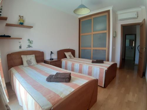 Кровать или кровати в номере Casa Sol da Falesia