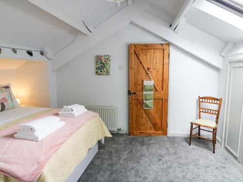 Postel nebo postele na pokoji v ubytování Smithy Cottage