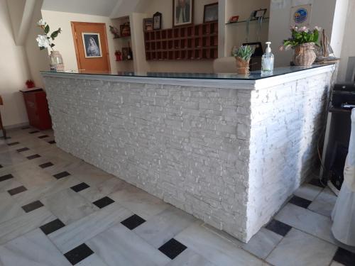 
a white marble counter top in a room at Verdelis Inn in Ancient Epidauros
