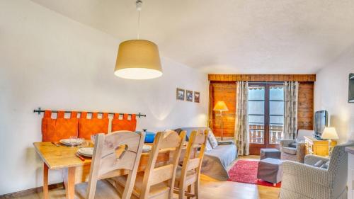 a dining room and living room with a table and chairs at Tovassiere - Apt B115 - BO Immobilier in Châtel