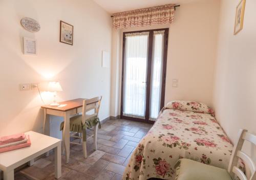 Postel nebo postele na pokoji v ubytování Rosa di Assisi