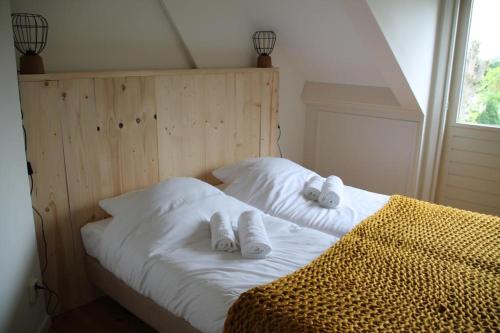 Säng eller sängar i ett rum på 't Wapen van Middelie