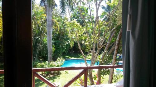 a view of a swimming pool from a window at Samara Beach Hotel in Sámara