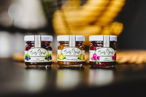 a group of four jars of honey on a table at BOHO HOUSE in Ustrzyki Dolne