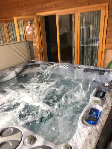 a jacuzzi tub with water pouring into it at Hotel Hof und Post in Innertkirchen
