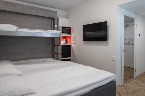 Ένα ή περισσότερα κρεβάτια σε δωμάτιο στο Omena Hotel Vaasa Espen