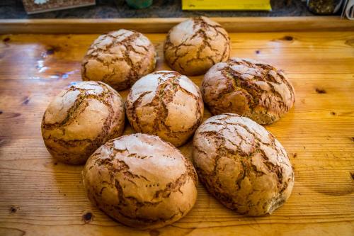 a group of muffins sitting on a wooden table at Bio-Bauernhof Obertrattenbachhof in Neukirchen am Großvenediger
