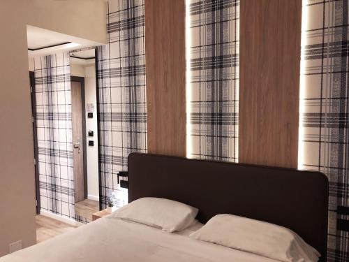 Postel nebo postele na pokoji v ubytování Hotel Ombra
