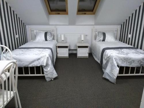 Postel nebo postele na pokoji v ubytování Centrum "Arka"