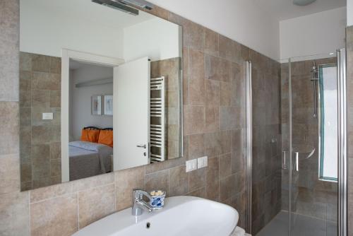 a bathroom with a sink and a mirror at B&B Al Piovego in Noventa Padovana