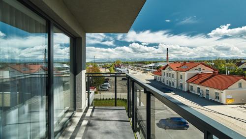 a balcony with a view of a city street at ibis Styles Nowy Targ in Nowy Targ
