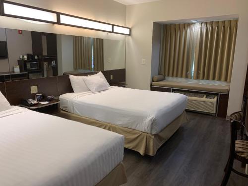 Katil atau katil-katil dalam bilik di Microtel Inn & Suites by Wyndham Pearl River/Slidell