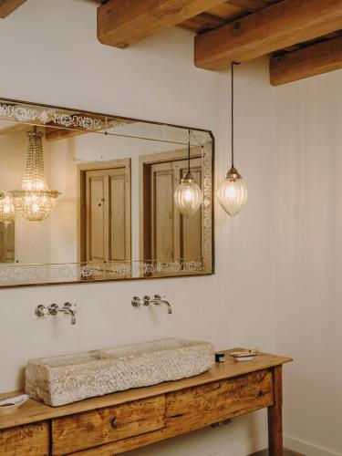 a bathroom with a sink and a mirror at Mas Generós - Adults-Only Eco Hotel in Fonteta
