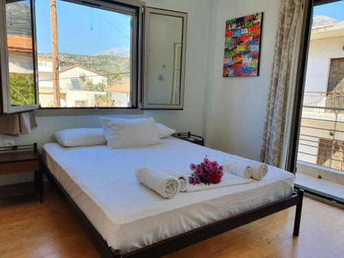 Ένα ή περισσότερα κρεβάτια σε δωμάτιο στο Tasos Rooms
