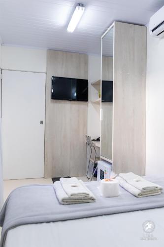 Ένα ή περισσότερα κρεβάτια σε δωμάτιο στο Hotel São Jorge